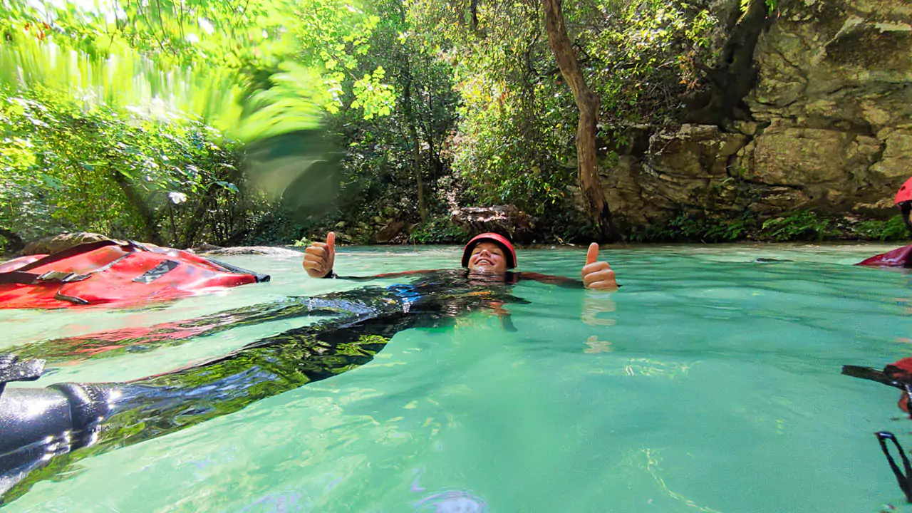 Explore Messinia-A boy smiling and relaxing at Polylimnio