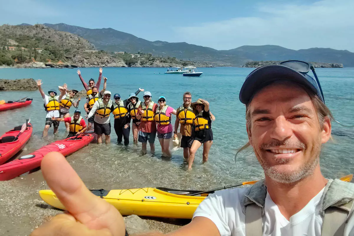 Explore Messinia-Header-Giorgos at Kalamitsi Beach in Kardamyli, after the Sea Kayak tour Pic Nic giving thumbs up.