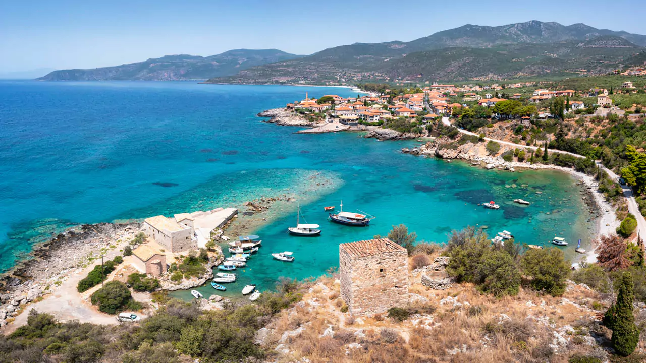 Explore Messinia-A stunning hilltop view of Kardamyli and its old port, a hidden gem, blending natural beauty with historic charm.